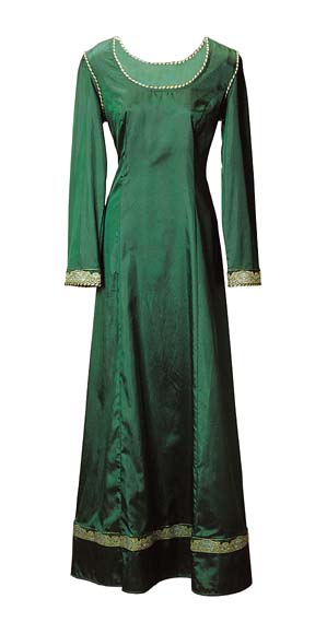 Emerald Dream Gown, long, slender silhouette with wide metallic trim on sleeves and above hemline, twisted gold and green piping on neckline, shoulders and sleeve ends  Lightweight, flowing fabric. Green only.