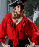 Barbossa Pirate Blouse in viscose velvet with ruffles around neck, down front and on cuffs of very full sleeves.  Red, white or black in sizes to XXL.