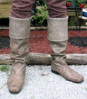 Robin Hood boots in tan leather, fold-down cuff.