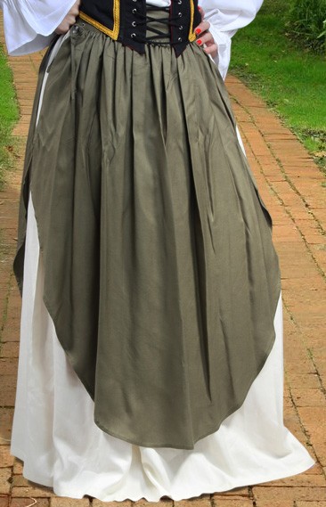 Apron skirt has removable apron and white petticoat layer beneath.