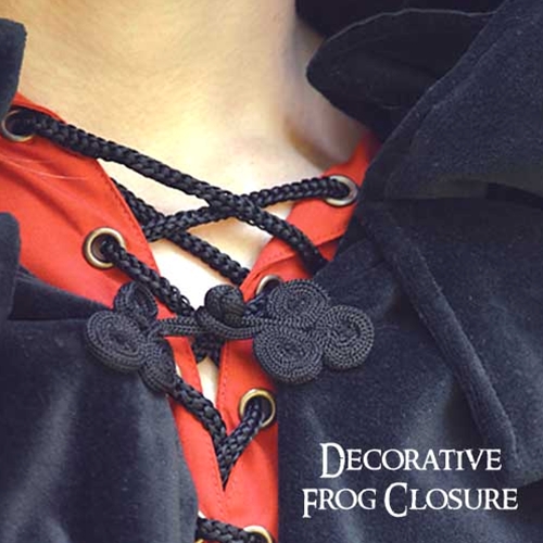 Close-up of decorative frog closure on childs velvet cloak