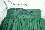 Detail of gathered skirt back lacing and eyelets.